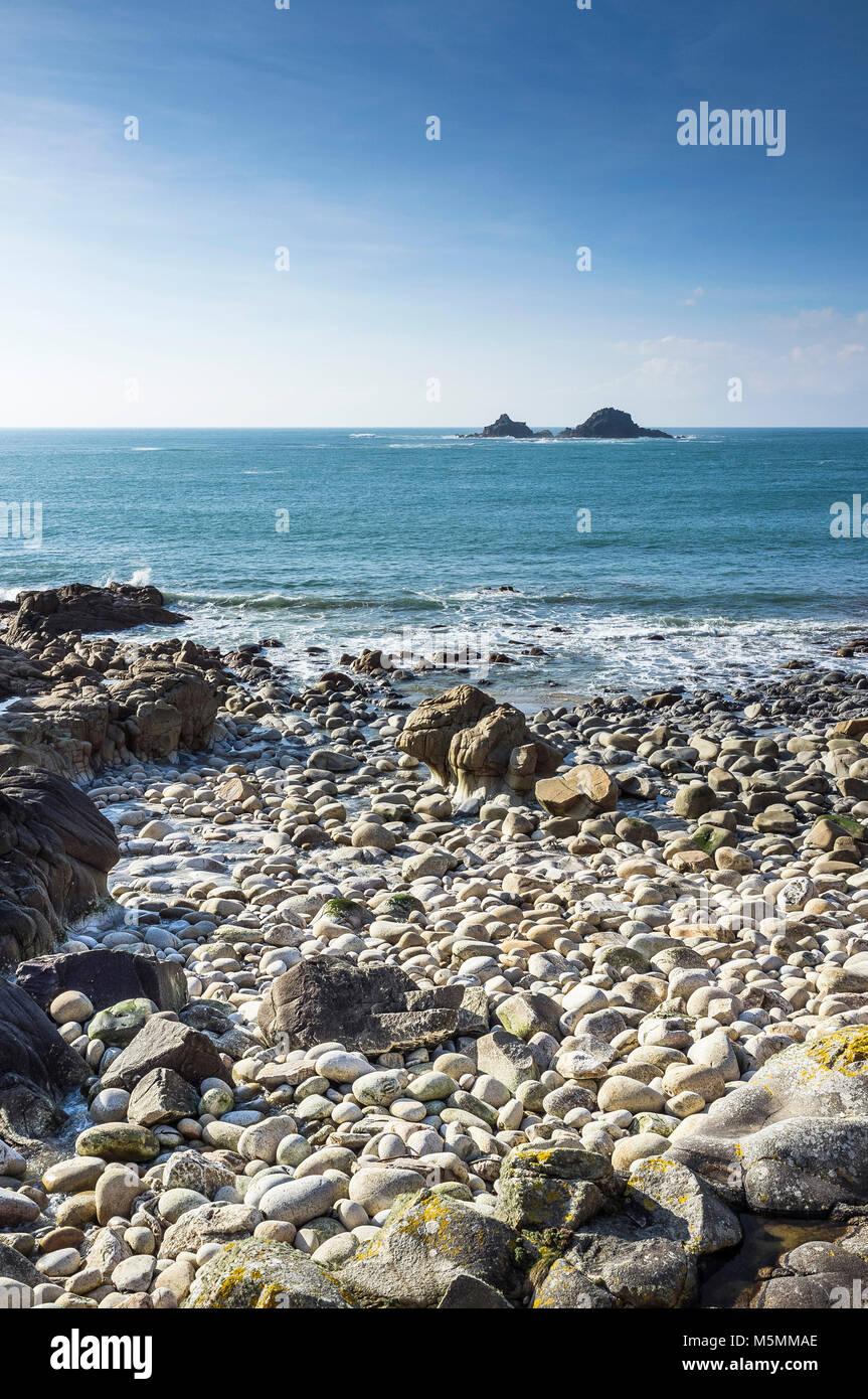 The Brisons off the coast of Porth Nanven in Cornwall. Stock Photo