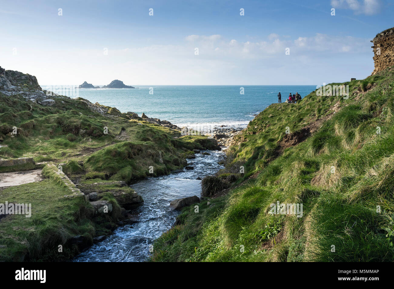 A stream flowing through Cot Valley into the Atlantic Ocean at Porth Nanven in Cornwall. Stock Photo