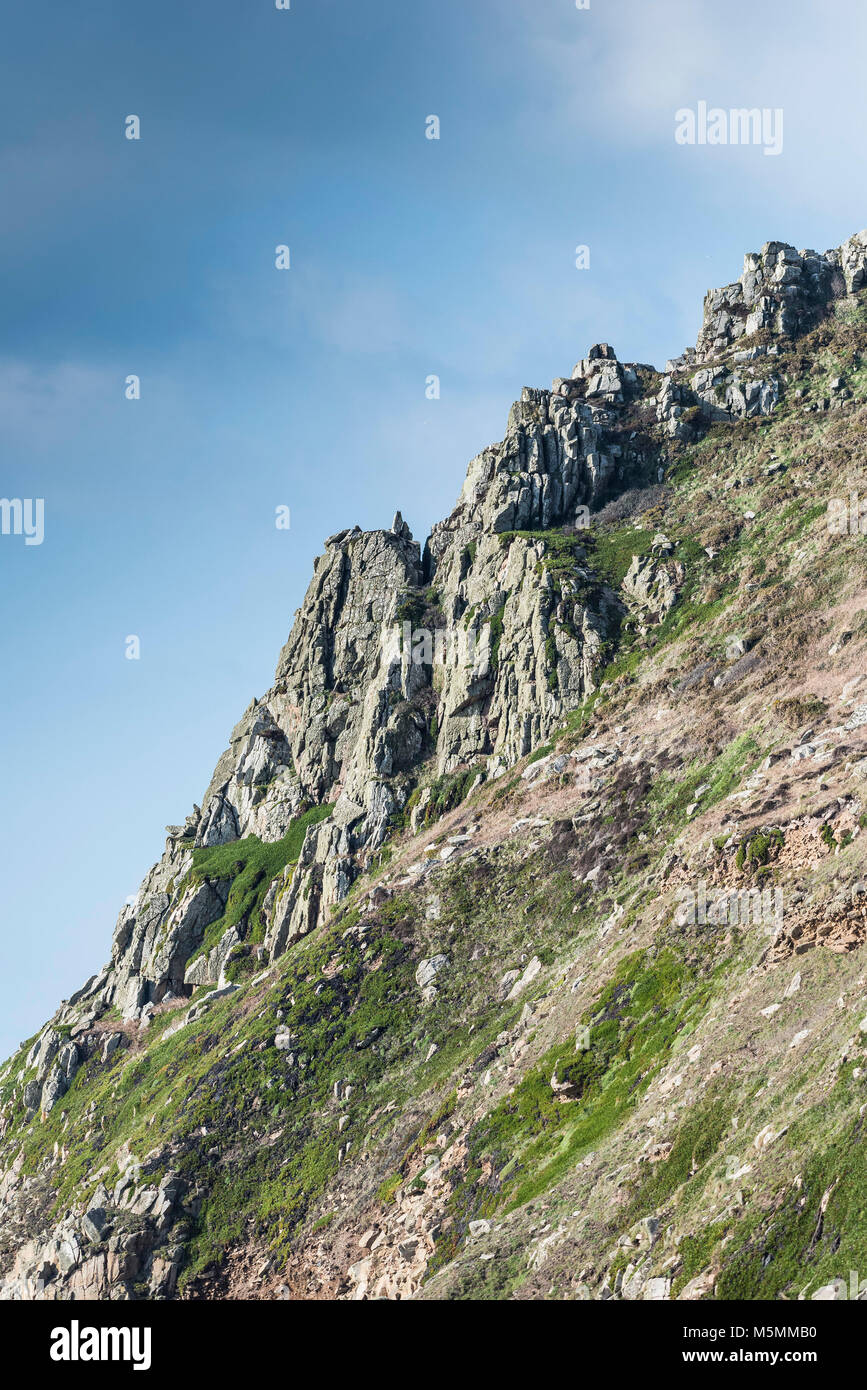 A rocky rugged headland overlooking Porth Nanven in Cornwall. Stock Photo