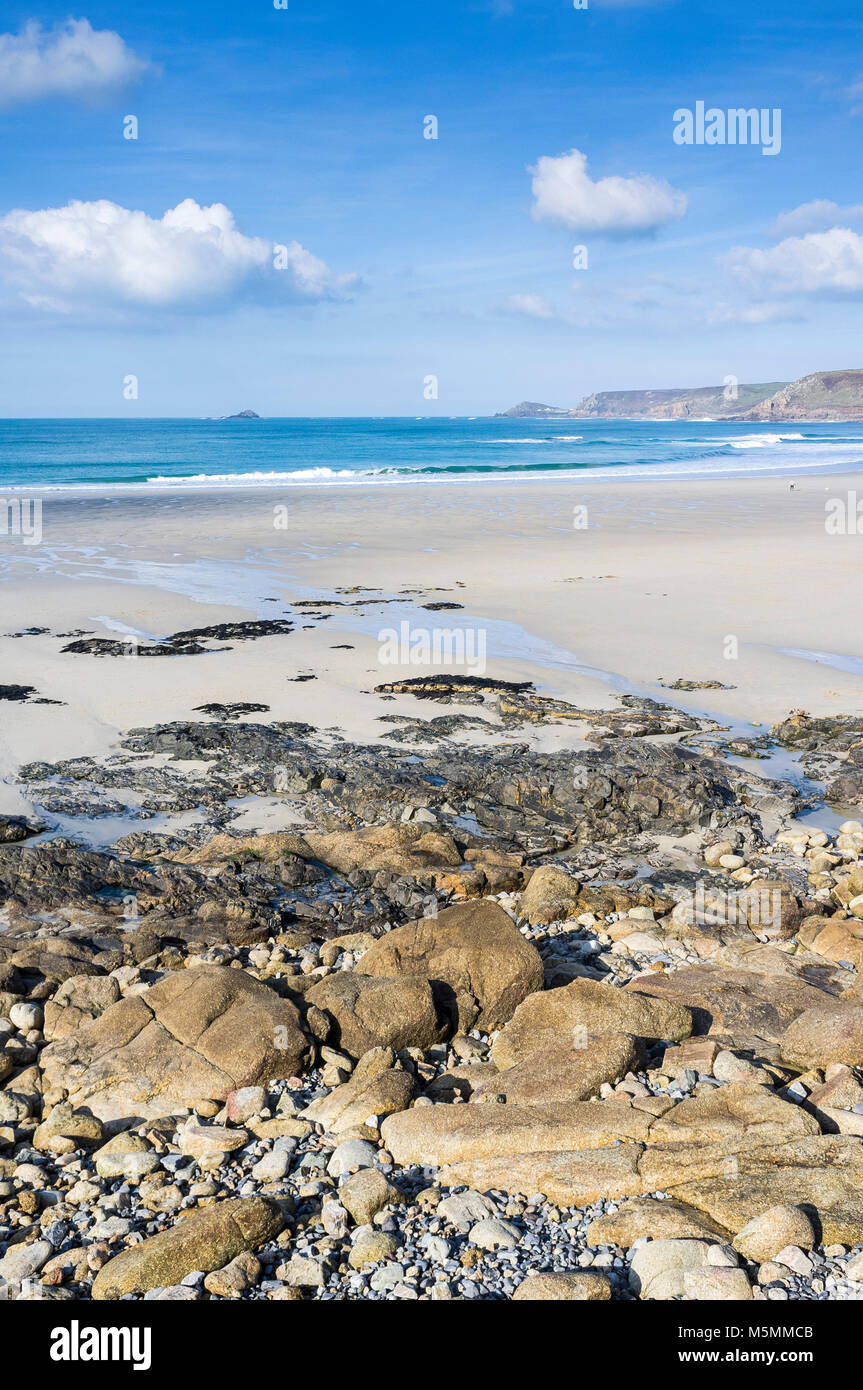 Rocks exposed at low tide in Sennen Cove in Cornwall. Stock Photo