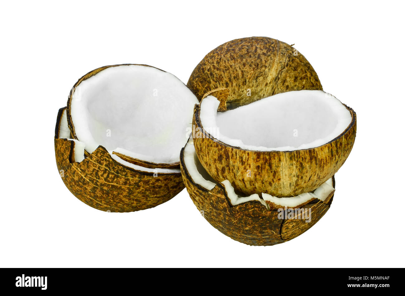 Cut coconut shell with fresh organic coconut kernel isolated on white background with clipping path. Coconut (Cocos nucifera). Cut coconut shell with  Stock Photo