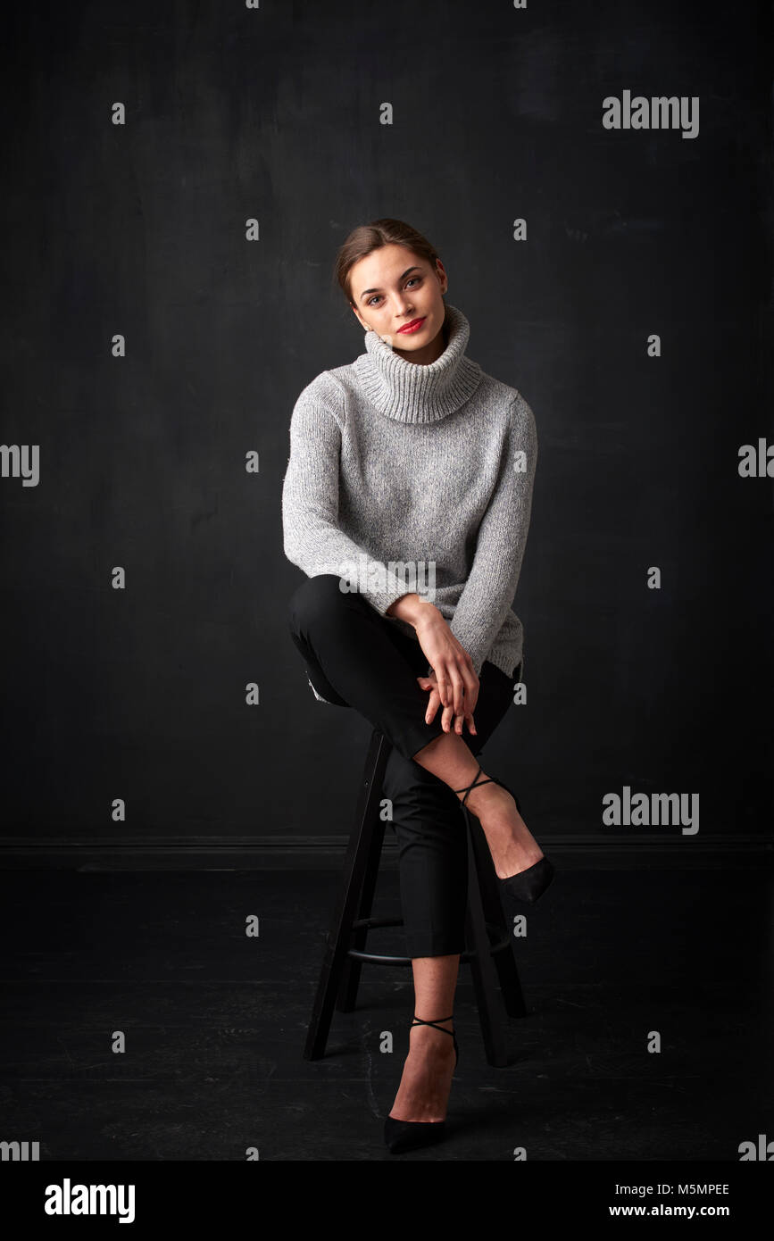 young woman wearing turtleneck sweater 