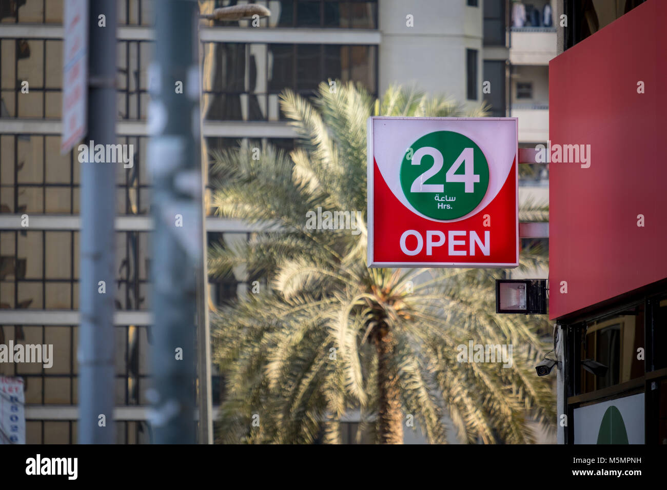Hanging signboard of a local grocery store open 24 hours Stock Photo Alamy