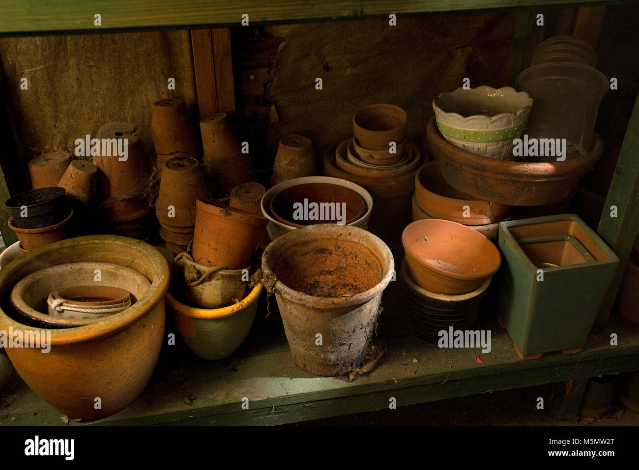 Terracotta pots in garden shed Stock Photo