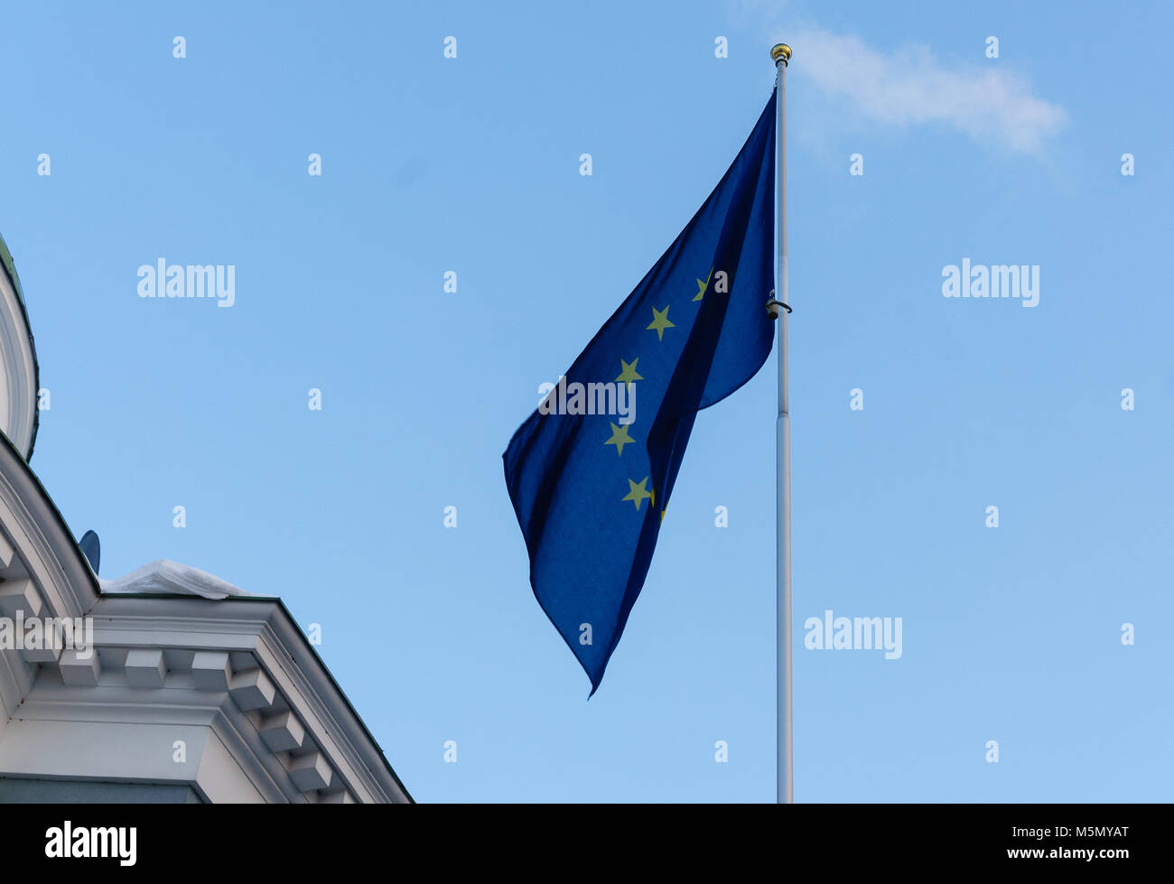 The official flag of the European Union on the flagpole against the ...
