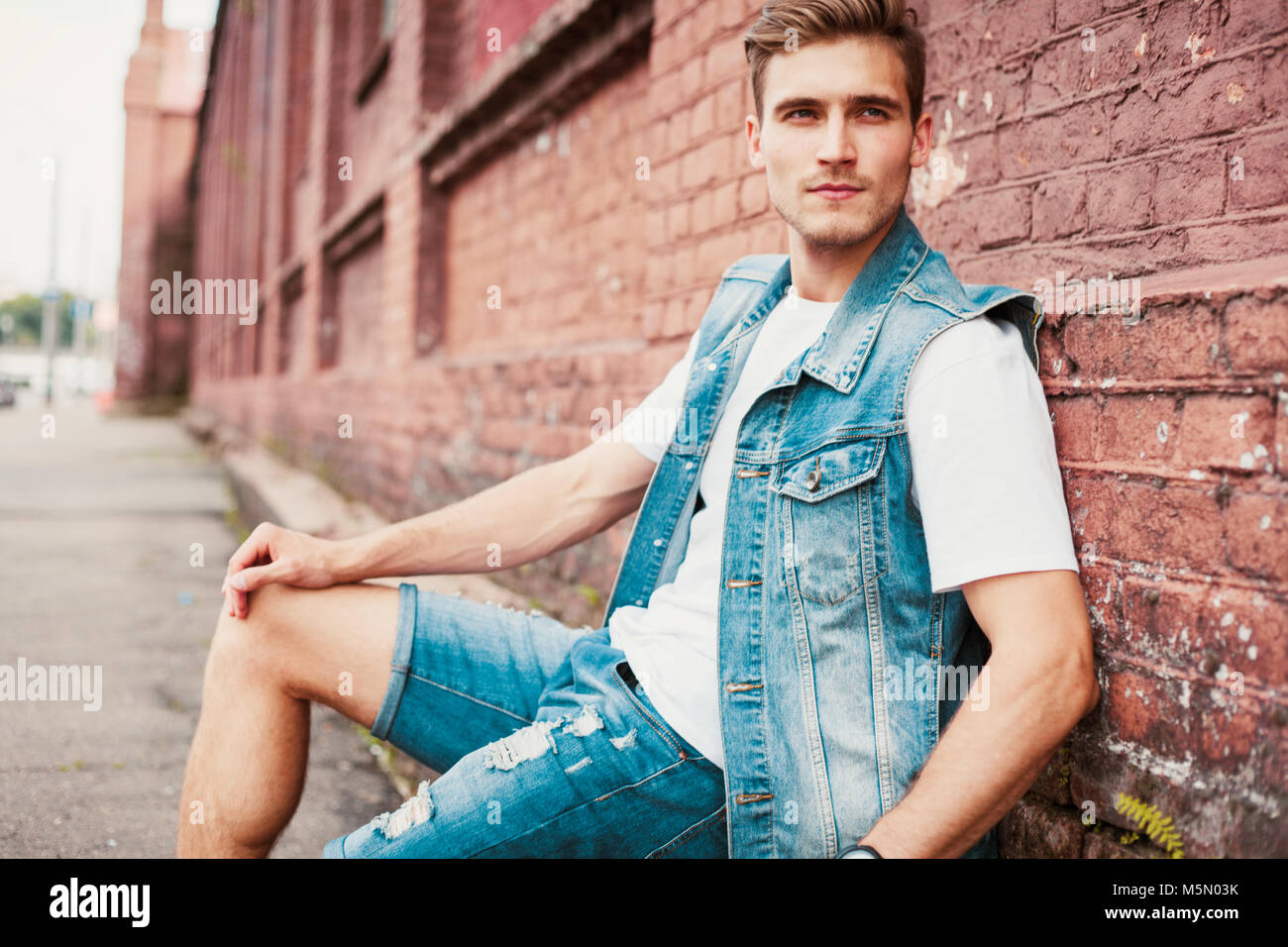 portrait of a trendy young man in the city Stock Photo - Alamy