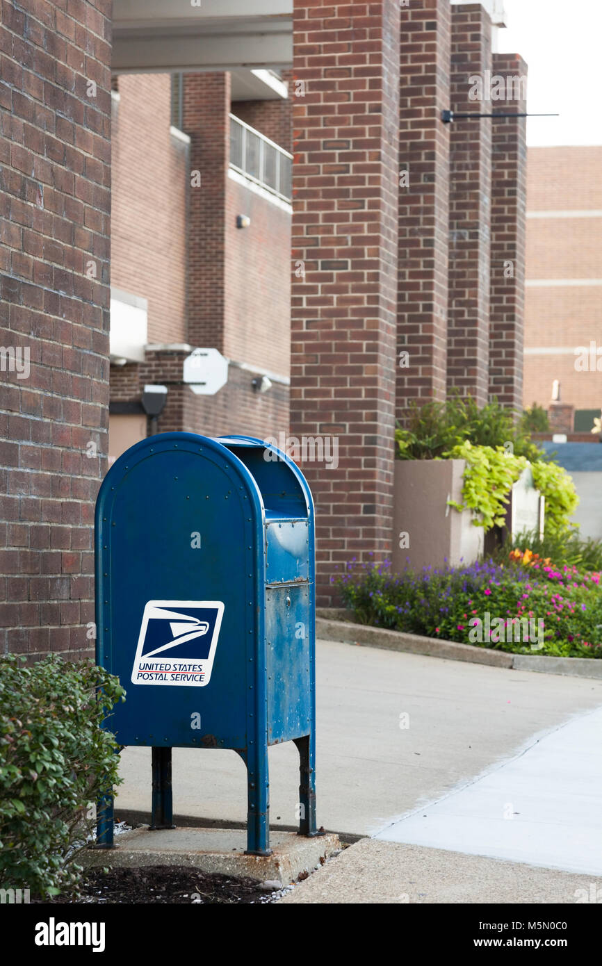 A United States Postal Service blue mailbox in USA America. Stock Photo