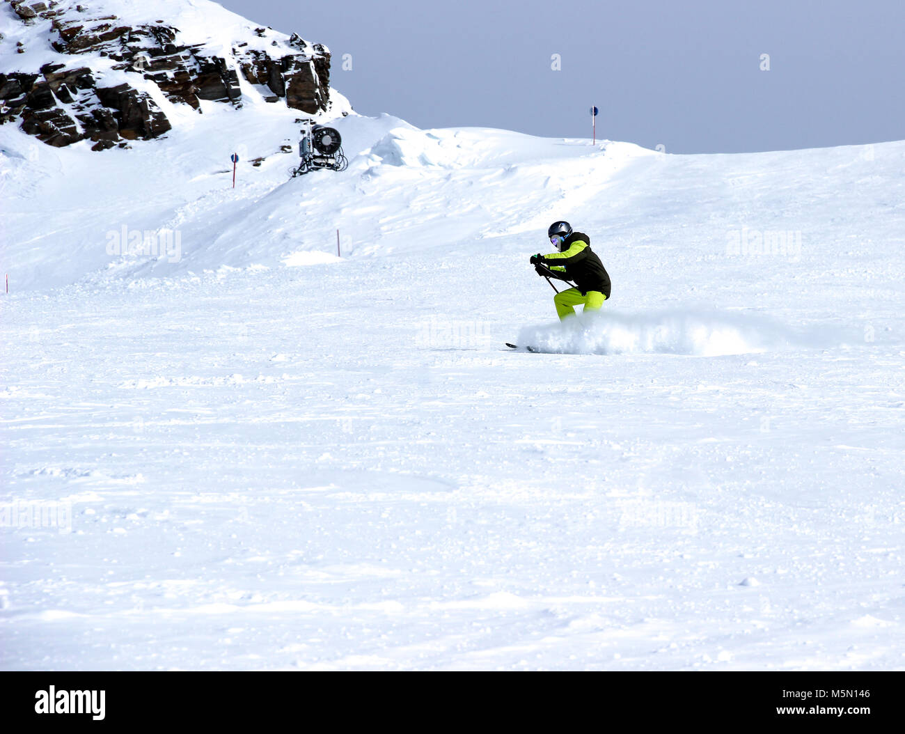 Mountain skiing, child boy skiing down the mountain Stock Photo