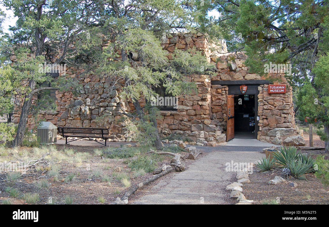 Grand Canyon National Park Tusayan Museum  . A visit to Tusayan Museum provides a glimpse into Pueblo Indian life at Grand Canyon some 800 years ago.   Admission is free. This was a thriving community as illustrated by its pottery, arrowheads and other household artifacts.  The Tusayan Museum is open daily from 9:00 a.m. to 5:00 p.m., and is located 3 miles (5 km) west of Desert View.  Tusayan Museum Exhibits: Also shown here Stock Photo