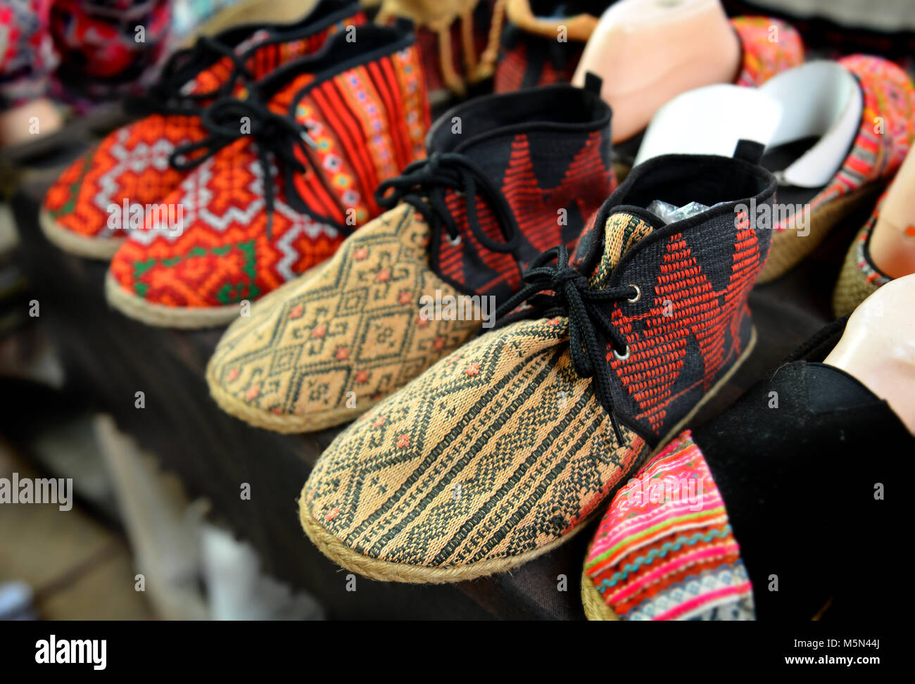 native handmade shoe sale on mountain of thailand Stock Photo - Alamy