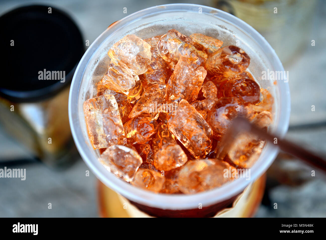 Fresh ice tea in plastic cup Stock Photo - Alamy