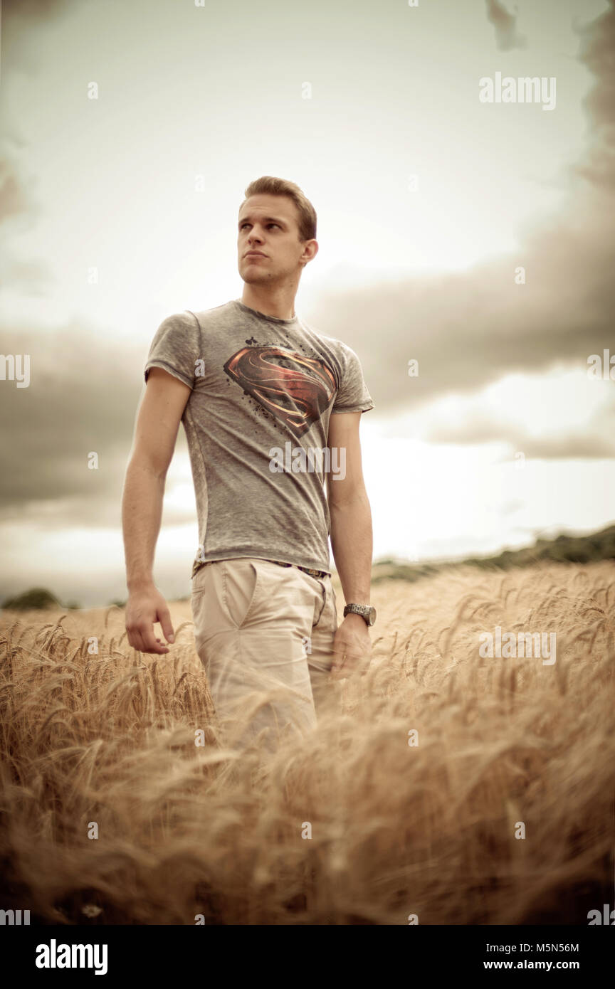 A location shoot of a young male in a cornfield. Photographer Claire Allen LRPS Stock Photo