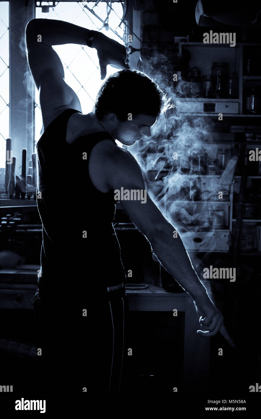 A location shoot of a male working out in a cold garage, steamy! Photographer Claire Allen, Devizes Stock Photo