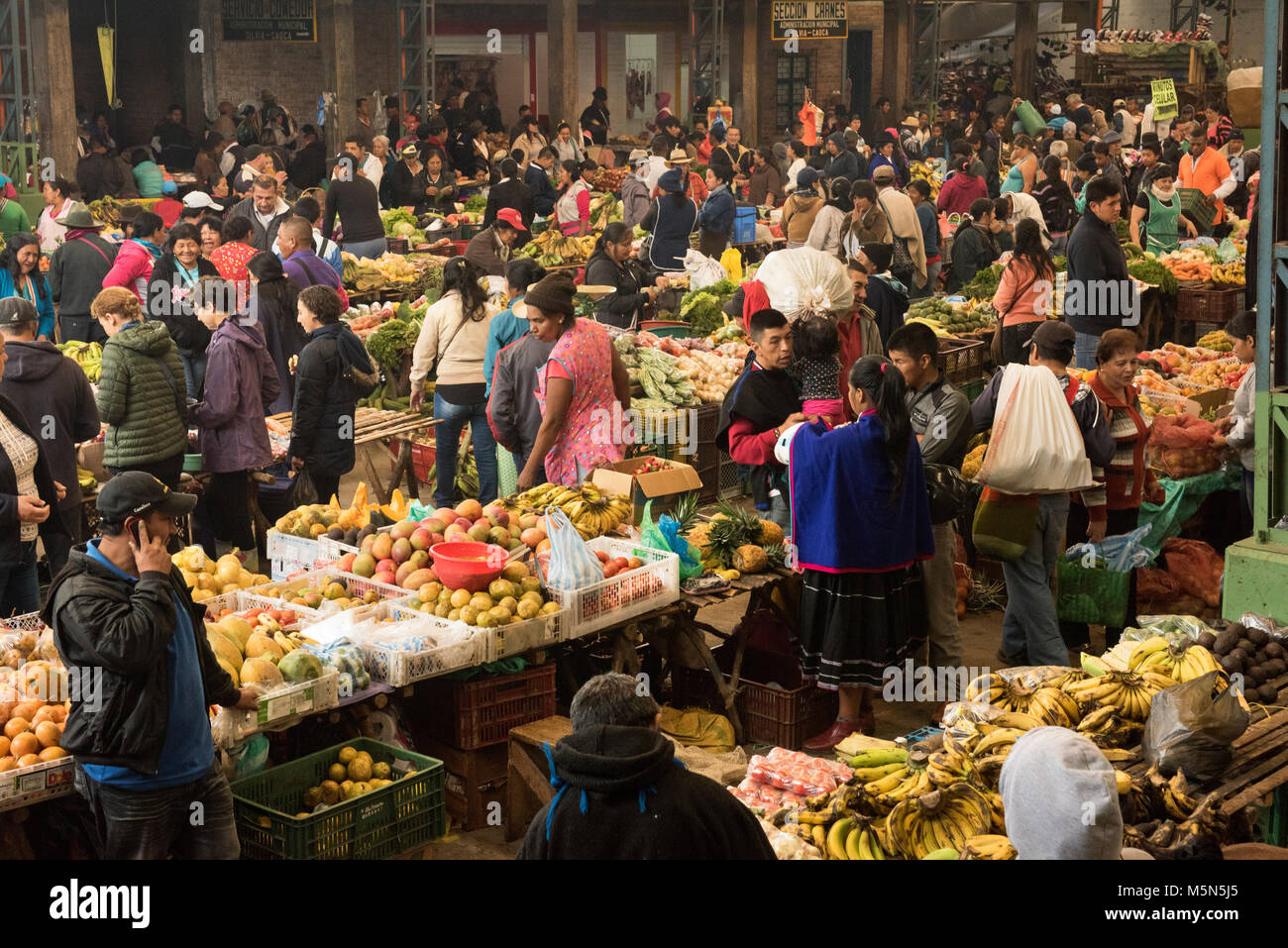 Silvia market near Popayan in Colombia with local people selling and buying fruit and vegetables Stock Photo
