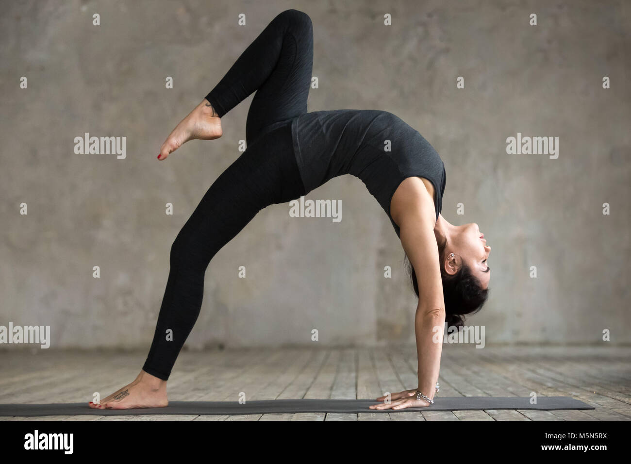 Slim Flexible Young Woman Doing Yoga Exercise Standing Bridge Position Gym  Stock Photos - Free & Royalty-Free Stock Photos from Dreamstime
