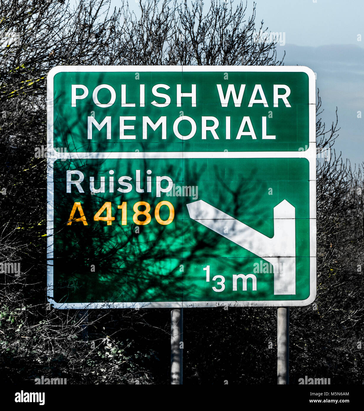 Polish War Memorial signpost on the A40 main road, also bearing the slip road / exit / turn off for Ruislip, Middlesex, West London, England, UK. Stock Photo