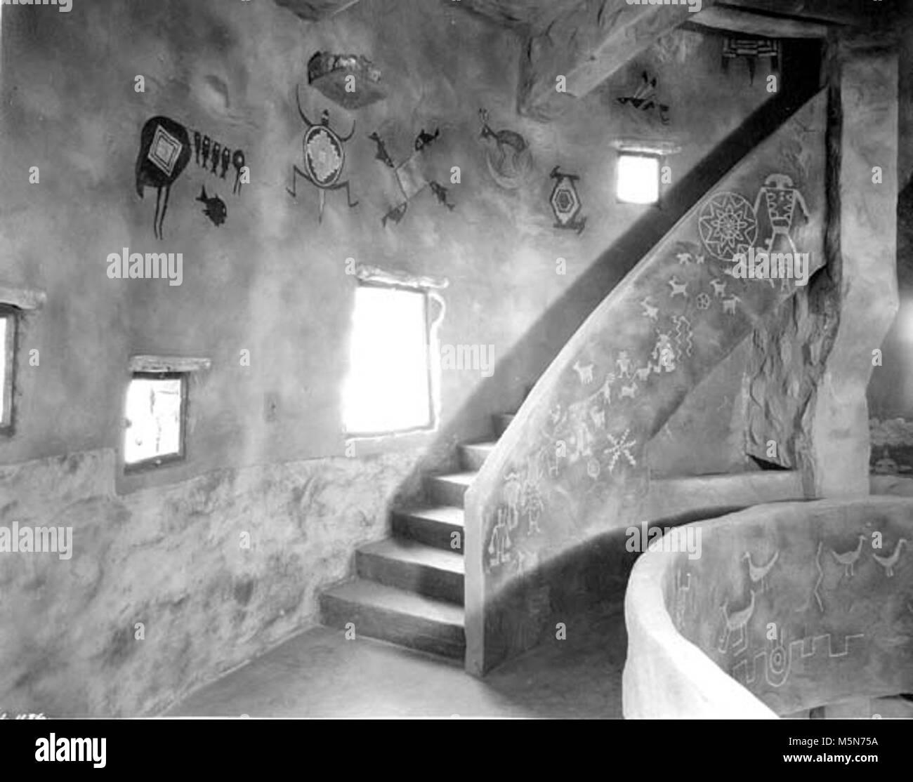 Grand Canyon Historic- Desert View Watchtower Interior c . DESERT VIEW WATCHTOWER. INTERIOR STAIRWAY TO SECOND GALLERY. 3 WINDOWS. GRCA 15955. CIRCA 1932. FRED HARVEY CO. Stock Photo