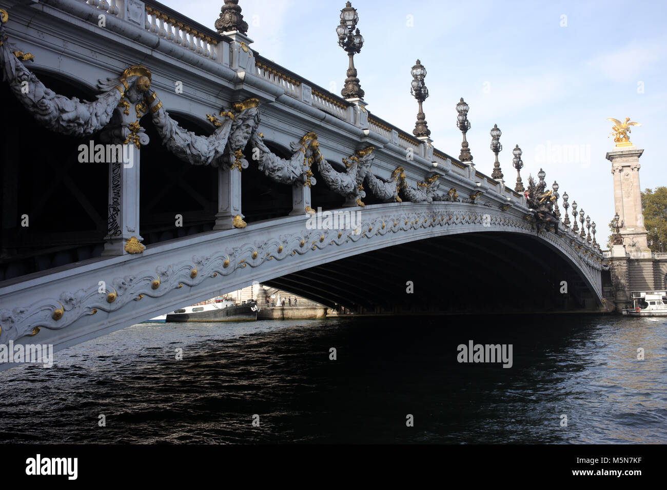 Pont Alexandre III spanning La Seine and connecting the Champs-Élysées  with the Invalides and Eiffel Tower - Paris Stock Photo