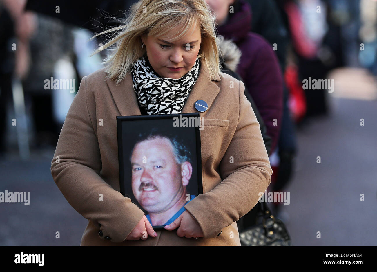Emma Rogan, holds a photo of her father Adrian who was shot dead in ...