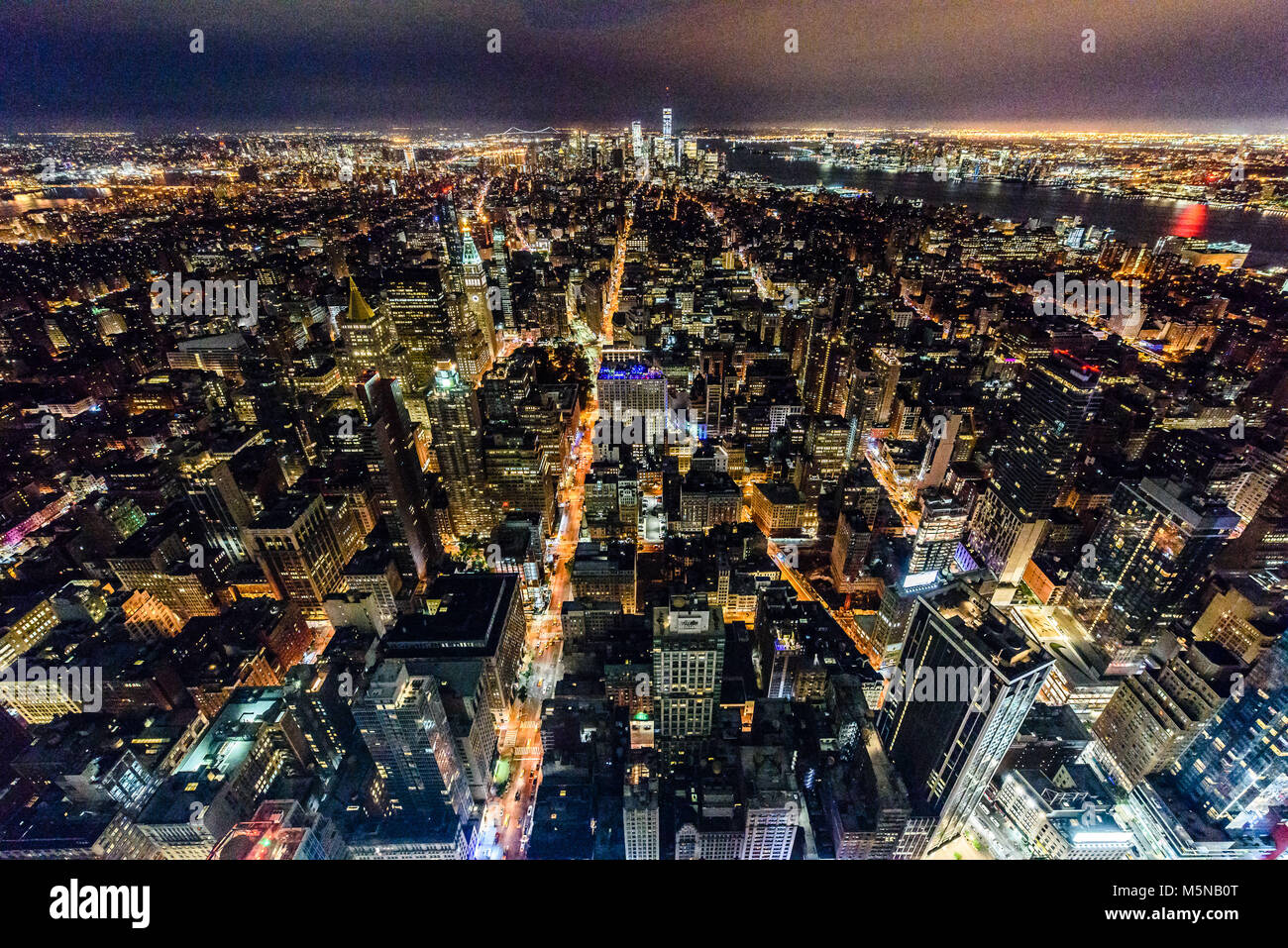 Aerial nightview of the buildings and skyscrapers of Manhattan illuminated Stock Photo