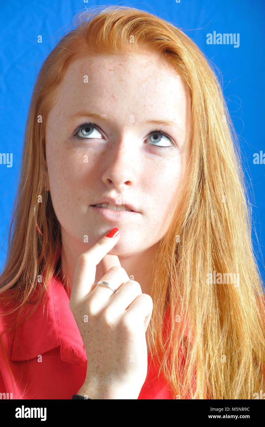 Girl thinking and looking somewhere up Stock Photo - Alamy