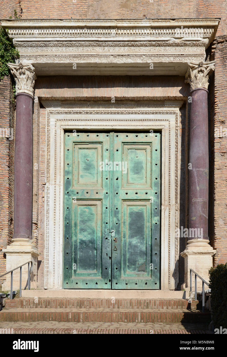 The green copper doorway of the Temple of Romulus & Remus in the Roman Forum in Rome, Italy Stock Photo