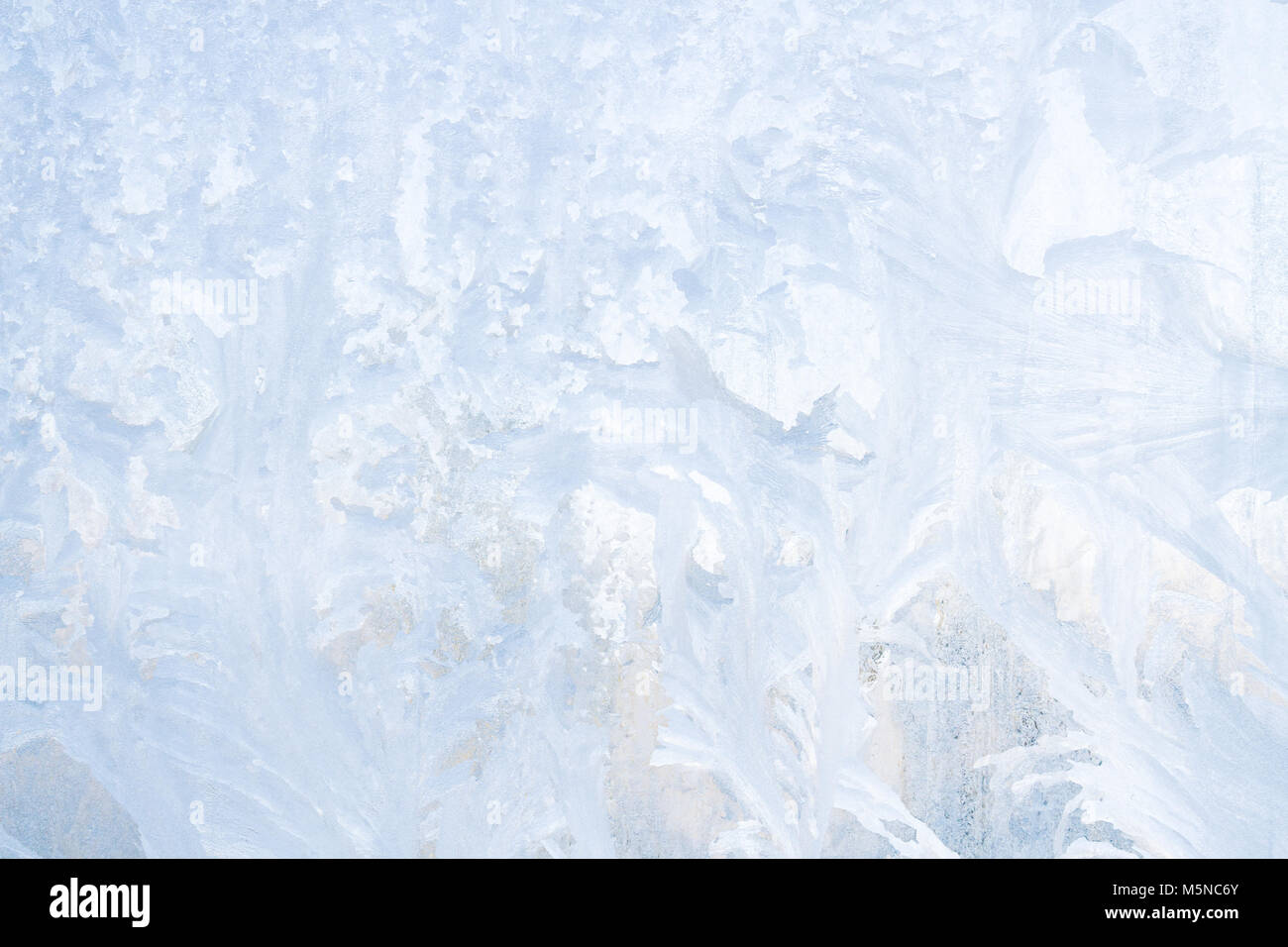 Winter frosty patterns on the frozen ice window Stock Photo - Alamy