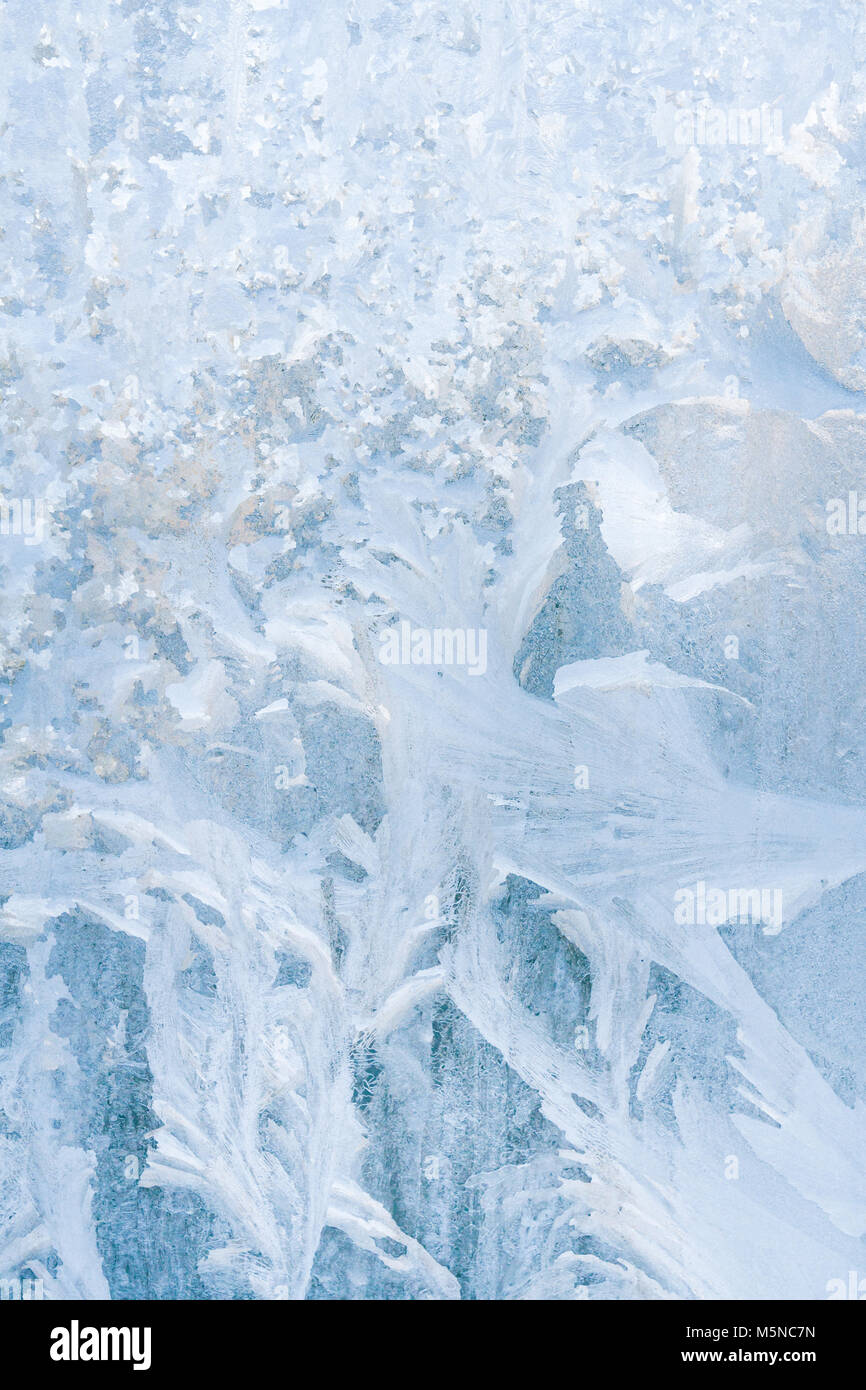 Winter frosty patterns on the frozen ice window Stock Photo - Alamy