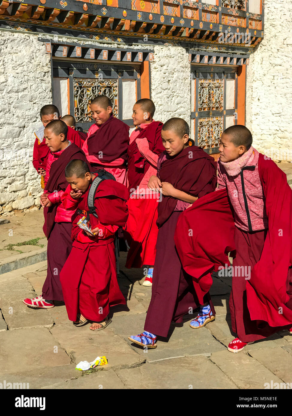 Bumthang, Bhutan. Young Buddhist Monks (Acolytes) at  a Religious Festival at  Jambay Lhakhang (Monastery/Temple). Stock Photo