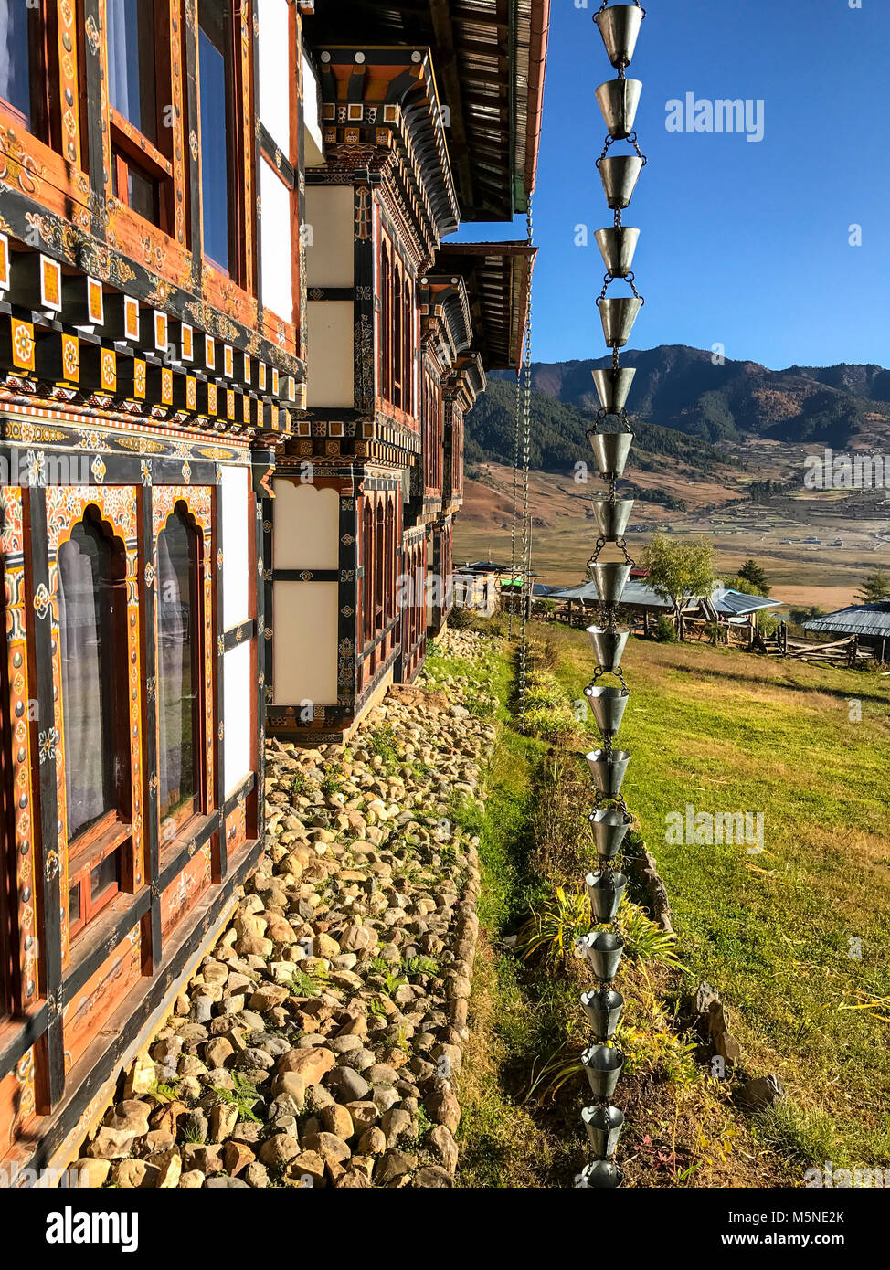 Phobjikha, Bhutan.  Dewachen Hotel Downspout to Channel Rainwater off of Roof. Stock Photo