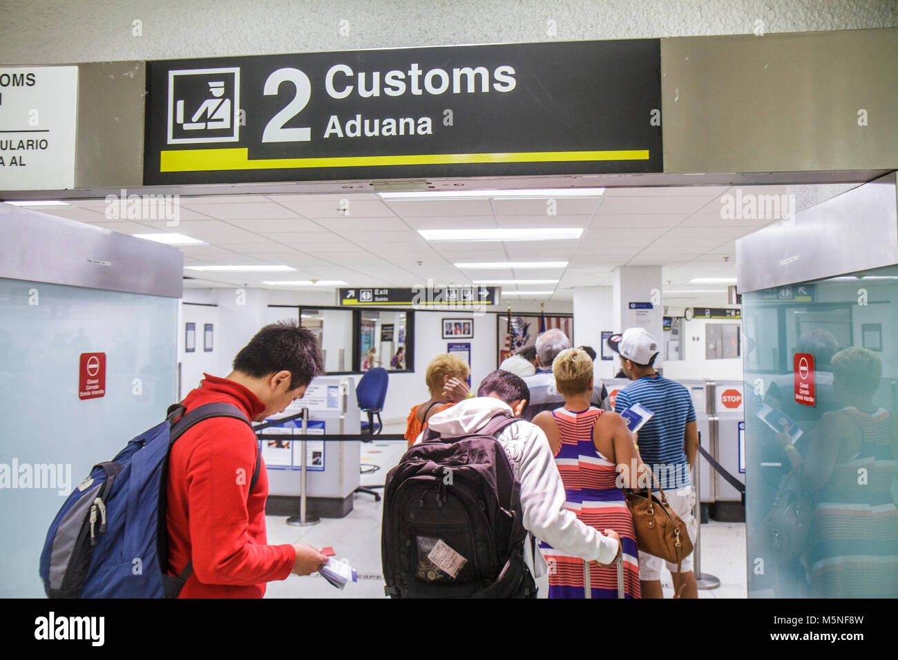 Miami Florida International Airport MIA,Customs,arriving passengers entering,line,queue,looking FL120621009 Stock Photo