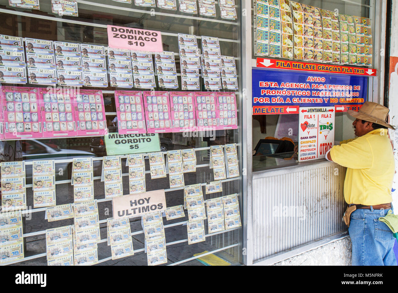 Cancun Mexico,Mexican,Avenida Tankah,lottery ticket,cashier window,display sale chance,luck,gamble,gambling,prize,Hispanic man men male adult adults,p Stock Photo