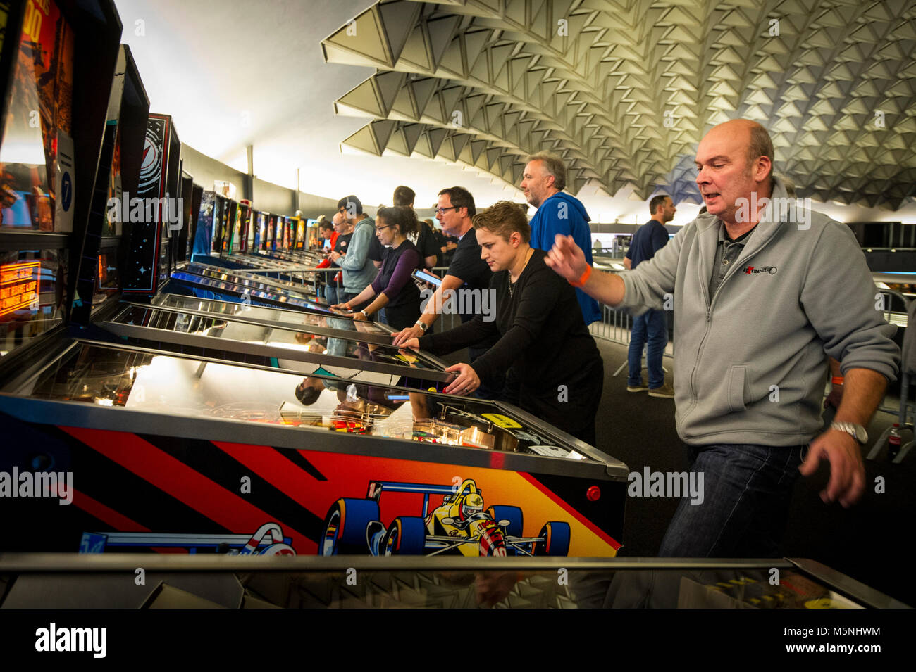 Playing pinball at the Dutch Championship in Eindhoven. Stock Photo