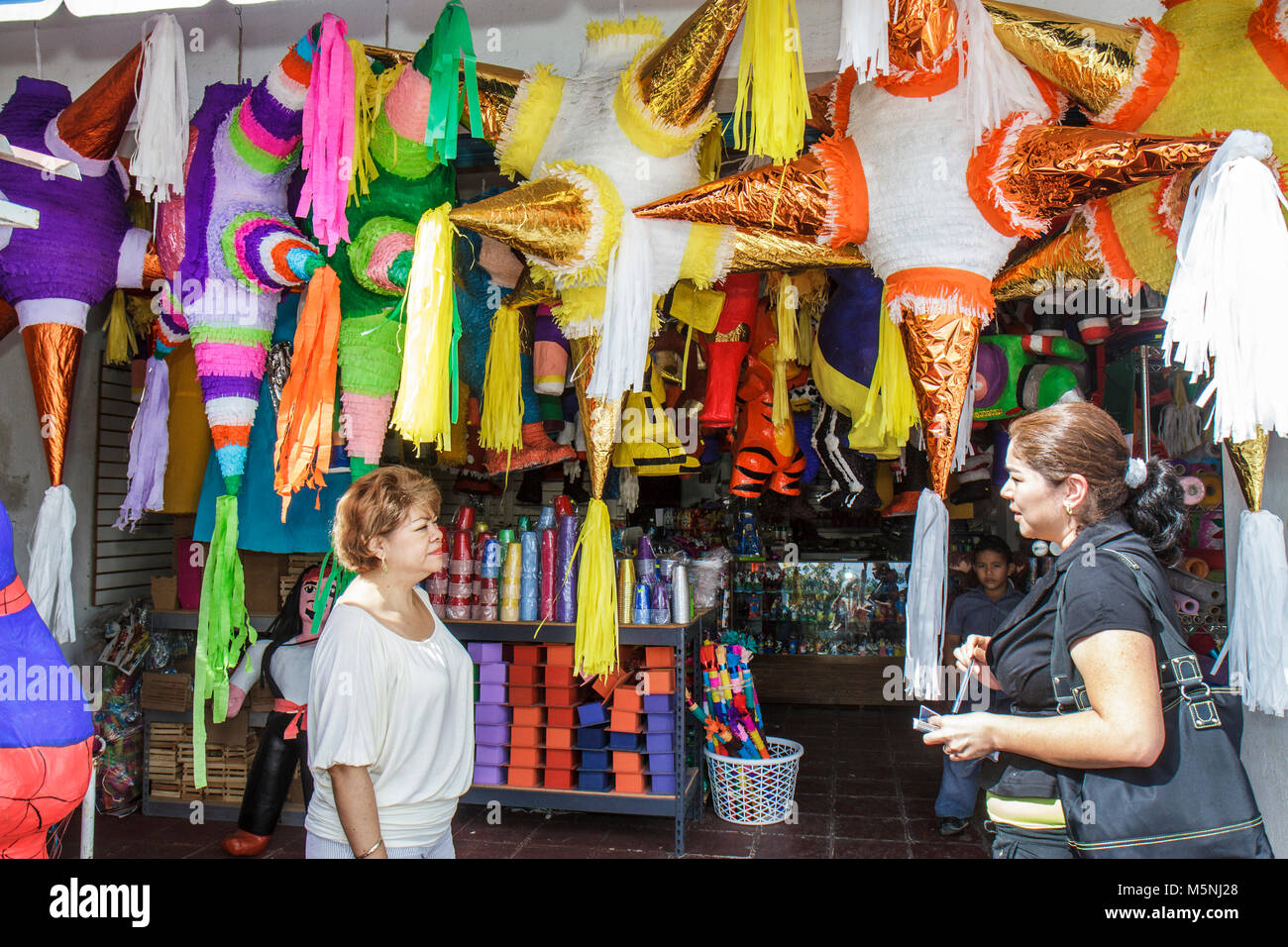 Cancun Mexico,Mexican,Mercado 28,piñata,display sale,small business,party supplies,traditional decoration,display sale papier mâché,Hispanic woman fem Stock Photo