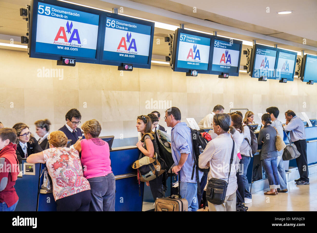 Cancun Mexico,Mexican,Cancun International Airport,aviation,ticket counter,check in,American Airlines,carrier,passenger passengers rider riders,depart Stock Photo