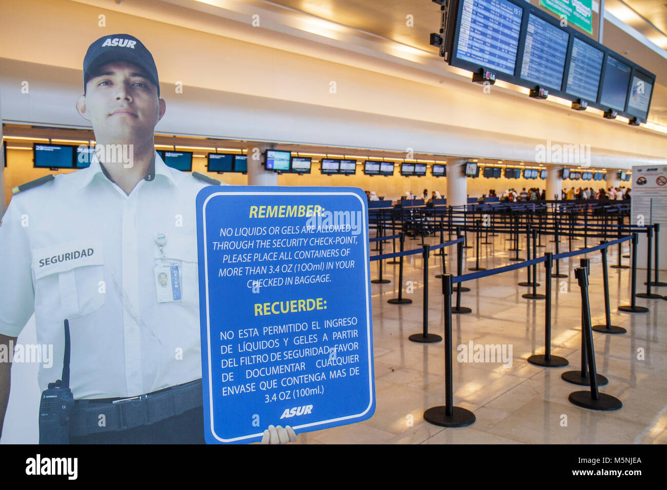 Cancun Mexico,Mexican,Cancun International Airport,aviation,anti terrorism,security checkpoint,life size cutout,officer,sign,reminder,prohibited items Stock Photo