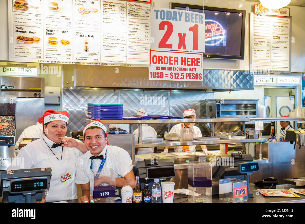 Cancun Mexico,Mexican,Cancun International Airport,Hispanic ethnic woman female women,man men male,Johnny Rockets,American fast food,restaurant restau Stock Photo