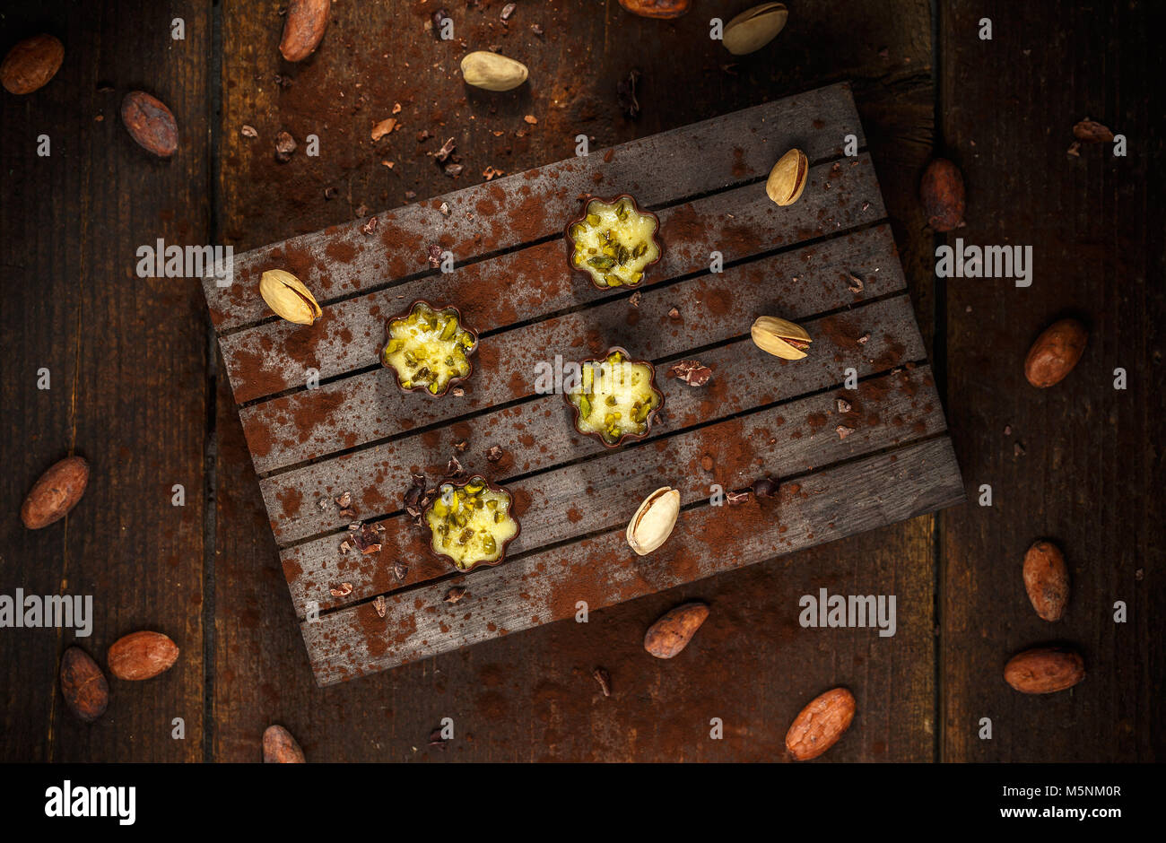 Top view of finest marzipan of pistachios in very thin-sliced dark chocolate Stock Photo