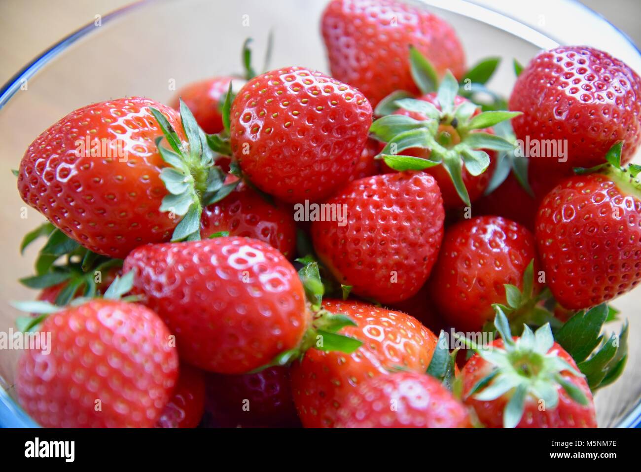 glass bowl full of strawberries Stock Photo - Alamy