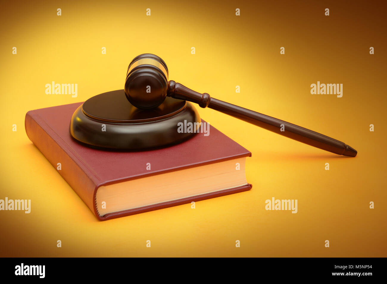 Wood Gavel on law red book yellow background Stock Photo Alamy