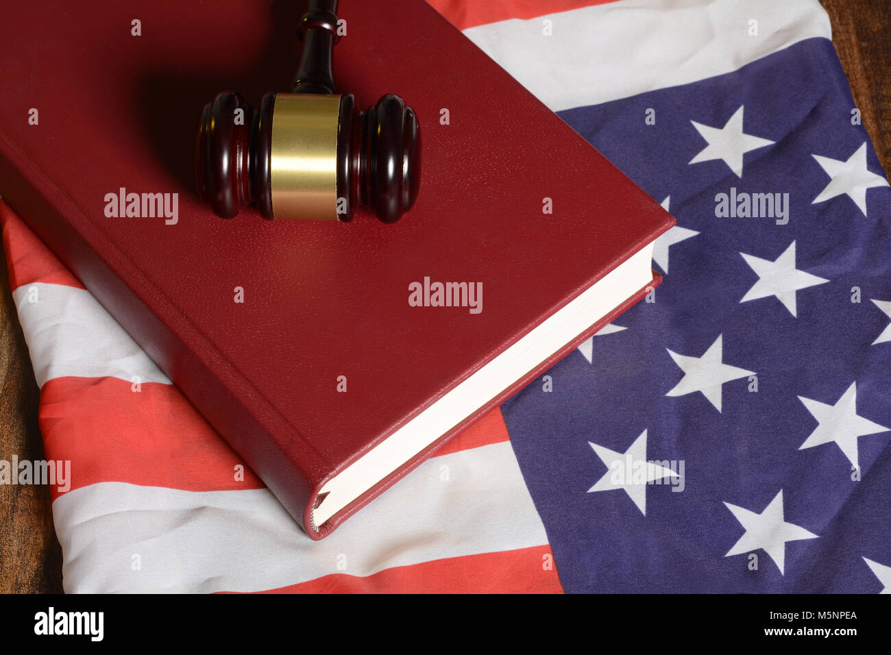 Gavel with law book on American flag Stock Photo Alamy
