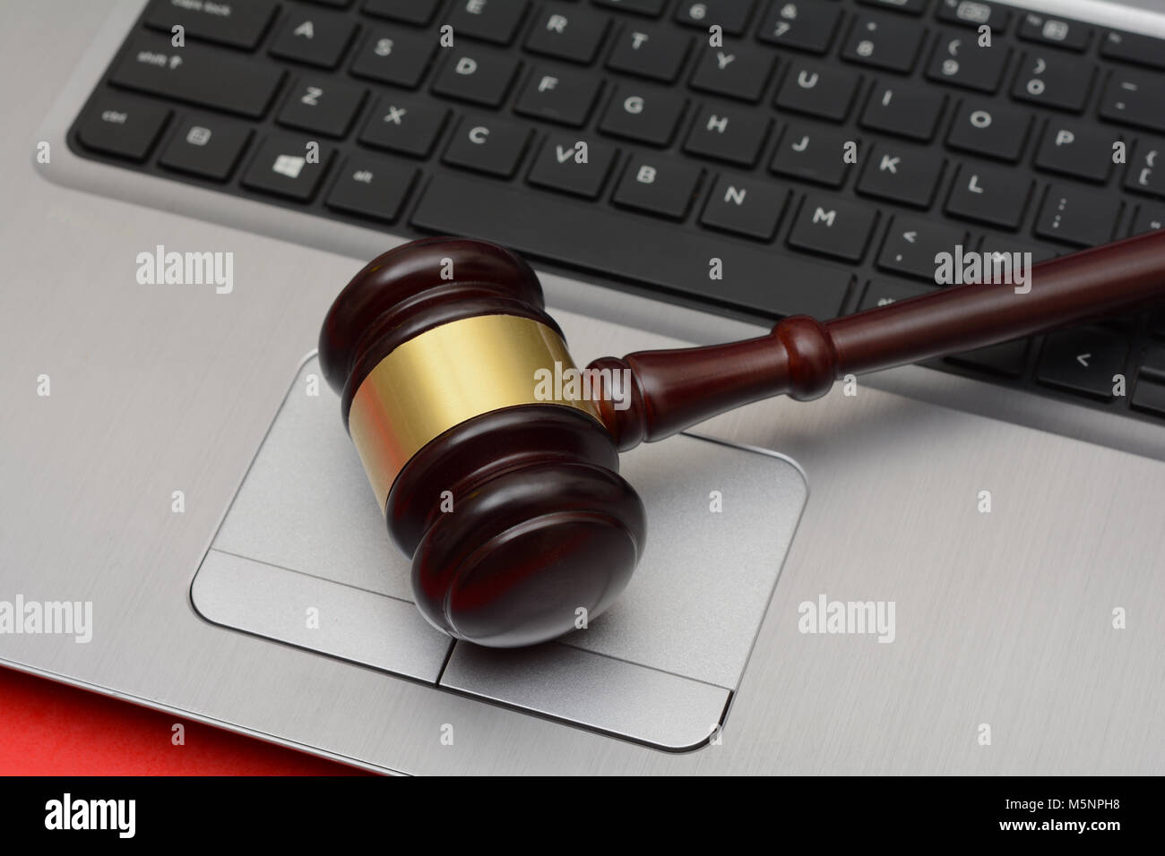 Online Auction wooden Gavel on computer keyboard Stock Photo