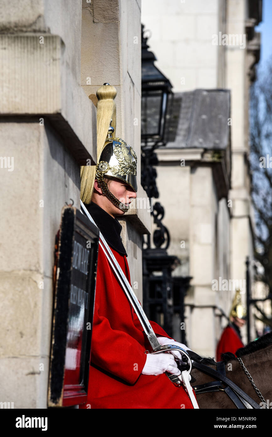 Mounted guard soldier in ceremonial winter dress guarding Horse Guards. Life Guards Household Cavalry. Whitehall, London Stock Photo