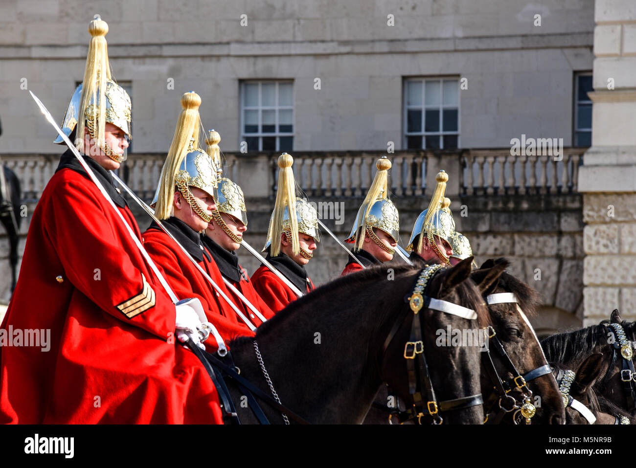 Changing of the guard, Horse Guards Parade, London. Life Guards Household Cavalry mounted soldiers in ceremonial winter dress. Horses Stock Photo