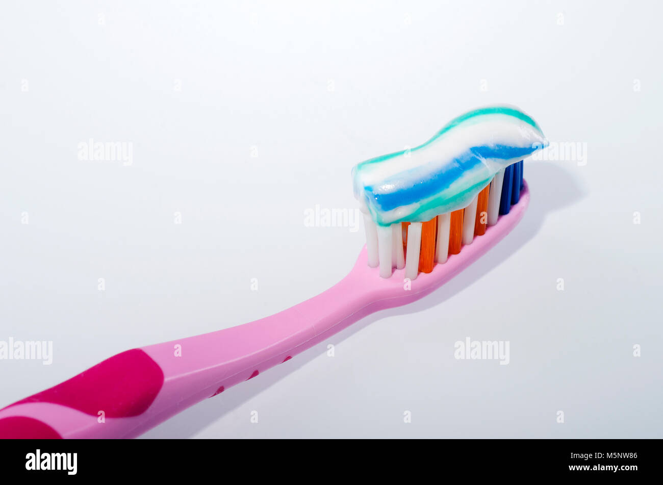 toothpaste on toothbrush isolated on white background Stock Photo - Alamy