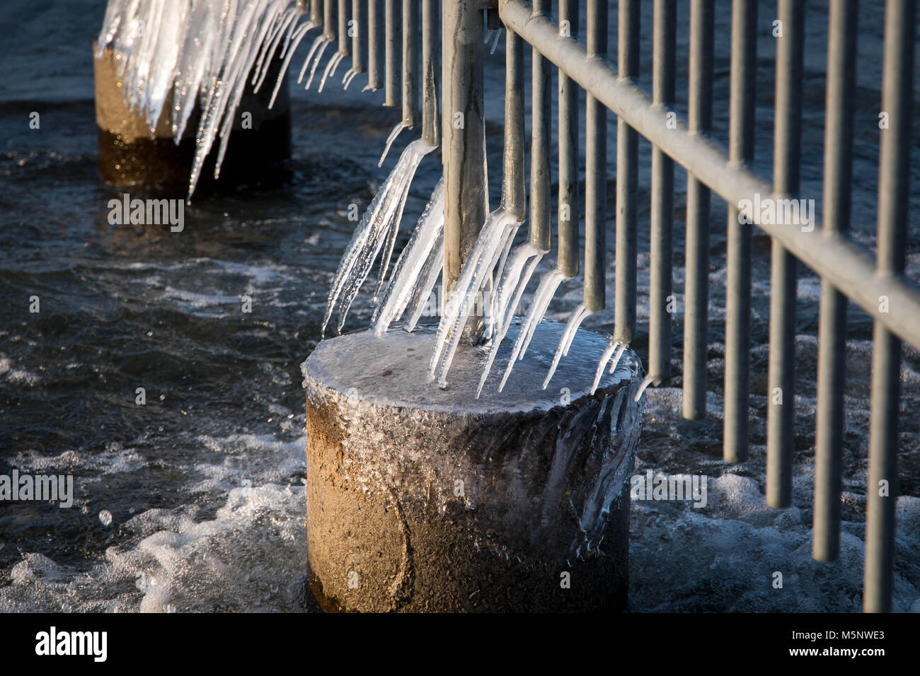 Frozen fence icy lake winter cold Stock Photo