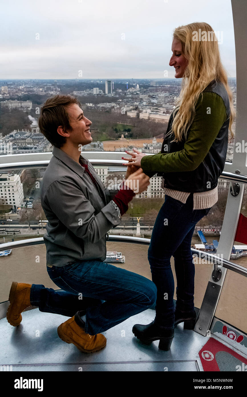 A Young Man Proposes To His Girlfriend On The London Eye, London, UK Stock Photo