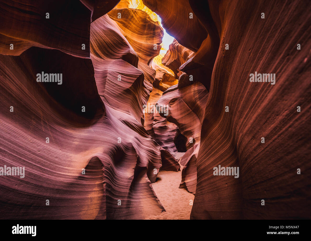 Amazing sandstone formations in famous Antelope Canyon on a sunny day in summer, Page, Arizona, USA Stock Photo