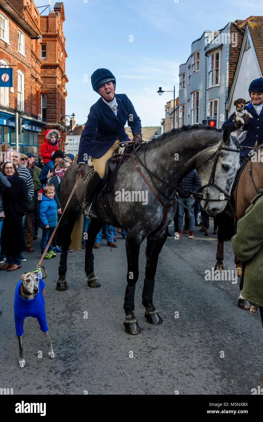 Hunt Members Holding On To A Pet Dog At The Southdown and Eridge Hunt’s Traditional Boxing Day Meeting, High Street, Lewes, Sussex, UK Stock Photo