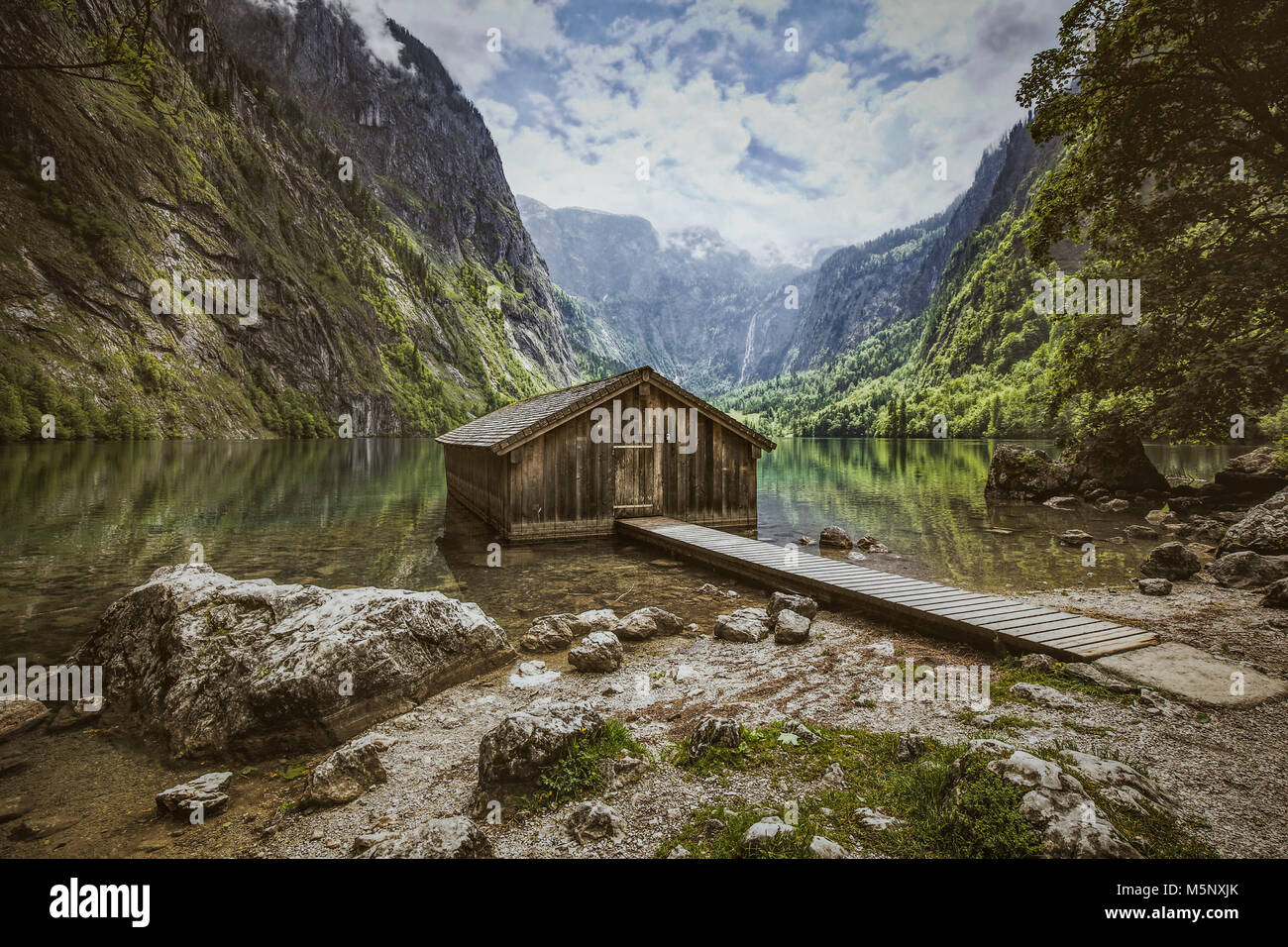 Beautiful view of traditional wooden boat house at the shores of famous Lake Obersee in Nationalpark Berchtesgadener Land in summer, Bavaria. Germany Stock Photo